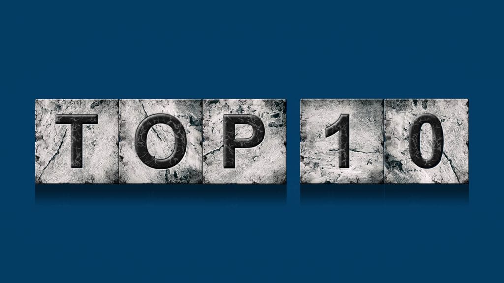Stylized 'TOP 10' inscription on stone blocks against a blue background, symbolizing the strength of top data solutions: features and pricing.